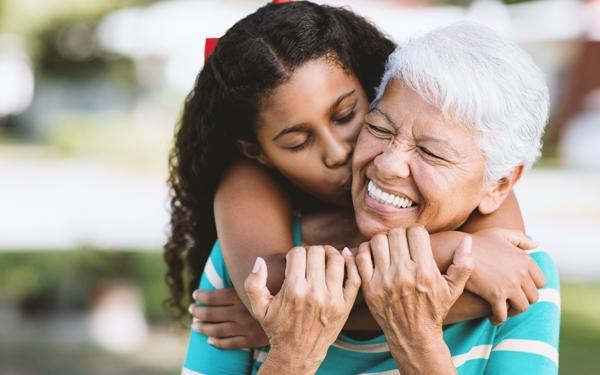 Young girl hugging an older woman