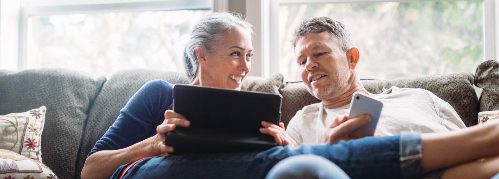Man and a woman looking at a tablet